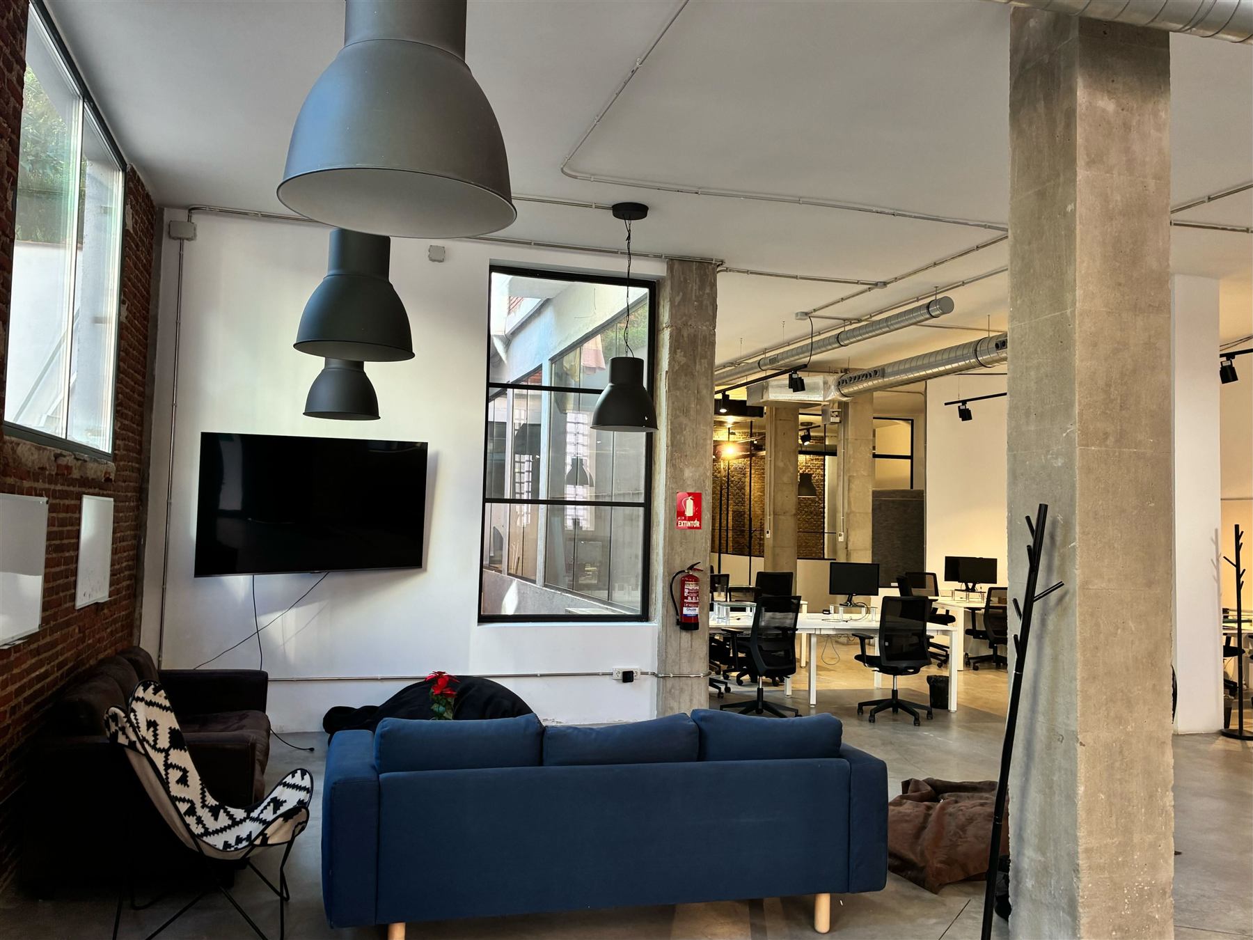 The Nova House lounge with sofa and TV