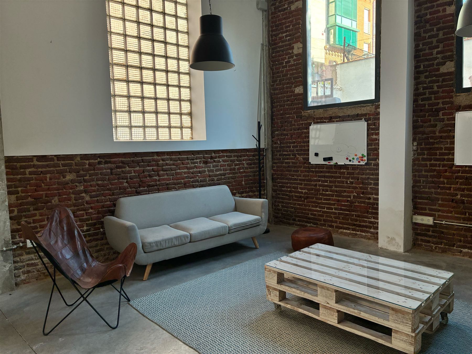 The Nova House chill zone with brick wall