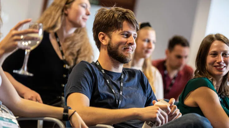 Members listening to a talk at a Nova event